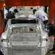 Tesla employees working on a Model S. Photo: AP